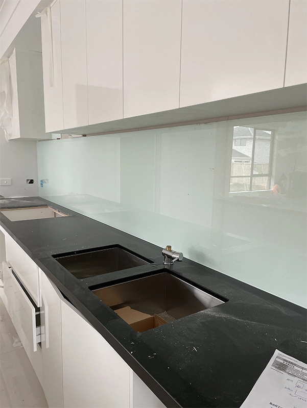Custom glass kitchen splashback installed in a modern Hervey Bay kitchen